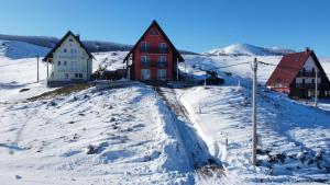 a house on a hill covered in snow at Villa Ela in Kupres