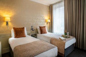 Ένα ή περισσότερα κρεβάτια σε δωμάτιο στο The Marcy Hotel