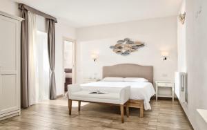 Ένα ή περισσότερα κρεβάτια σε δωμάτιο στο Smart Suite & Apartments