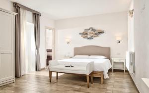Voodi või voodid majutusasutuse Smart Suite & Apartments toas