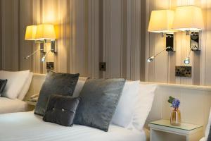 Ένα ή περισσότερα κρεβάτια σε δωμάτιο στο The Marcy Hotel