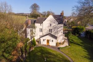 an aerial view of a white house with a yard at The Old Rectory Chicklade in Chicklade