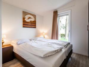 เตียงในห้องที่ Holiday Home Green Resort Mooi Bemelen by Interhome +11 ภาพ