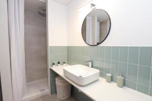 Een badkamer bij APARTAMENTS AGNETA - Rem