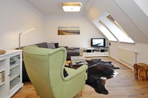 Televiisor ja/või meelelahutuskeskus majutusasutuses Residenz unter den Linden Wohnung 27