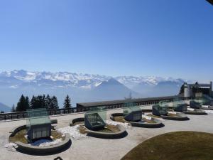 a row of chairs sitting on top of a mountain at Apartment Casa Margherita Bütler ! Autofrei ! by Interhome in Rigi Kaltbad