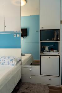 Postel nebo postele na pokoji v ubytování Apartments & Rooms Andrea 2