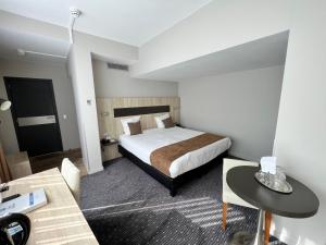 En eller flere senger på et rom på Best Western Hotel Royal Centre