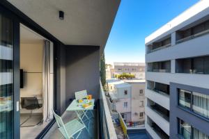 an apartment balcony with a view of a building at Apartments Hica in Dubrovnik