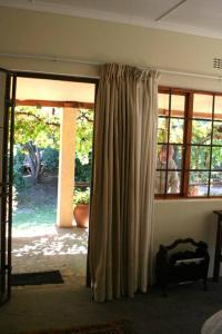 a room with a sliding glass door with a window at 34 Steyn Street, Barrydale in Barrydale