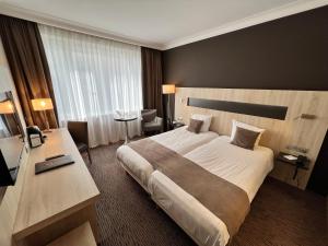 Postel nebo postele na pokoji v ubytování Best Western Hotel Royal Centre