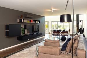 a living room with a couch and a table at TheCalming Cactus Cascais in Estoril