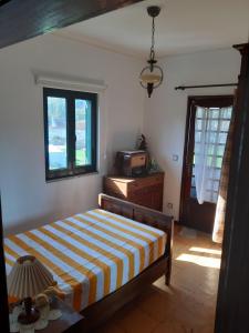 Ένα ή περισσότερα κρεβάτια σε δωμάτιο στο Quinta Drº Amarante