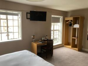 Postel nebo postele na pokoji v ubytování The Market House