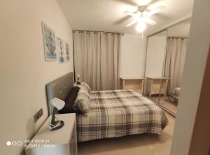 Posteľ alebo postele v izbe v ubytovaní Apartamento Castillo Bajo
