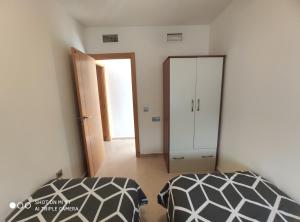 Posteľ alebo postele v izbe v ubytovaní Apartamento Castillo Bajo