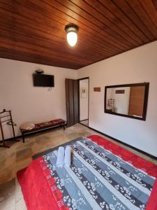 Cama ou camas em um quarto em Pousada Ikabana