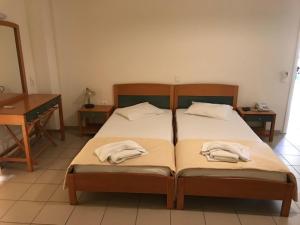Ένα ή περισσότερα κρεβάτια σε δωμάτιο στο Diamanti Hotel