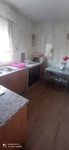 a kitchen with a sink and a counter top at Casa Campanita in Ribadeo +12 photos