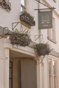 a building with flower boxes on the front of it at The Yard in Bath Hotel in Bath