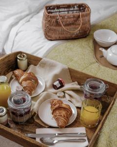 
a tray with a basket of food and a cup of coffee at The Yard in Bath Hotel in Bath
