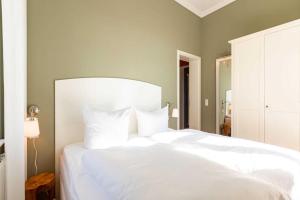 Postel nebo postele na pokoji v ubytování Villa Charlottes Höh App 6