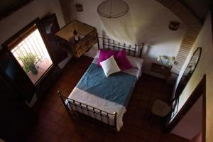 Łóżko lub łóżka w pokoju w obiekcie Casa Rural El Zumacal