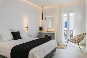 Ένα ή περισσότερα κρεβάτια σε δωμάτιο στο Sunset Windmills Suites