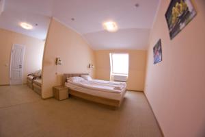 Postel nebo postele na pokoji v ubytování Budget Hotel Ekotel