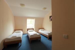 Postel nebo postele na pokoji v ubytování Budget Hotel Ekotel