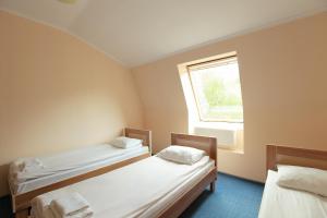 Postel nebo postele na pokoji v ubytování Budget Hotel Ekotel