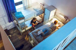 A bed or beds in a room at LoL Hostel Siracusa