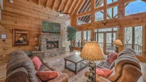 a living room with a couch and a fireplace at Bearfoot Lodge in Epworth