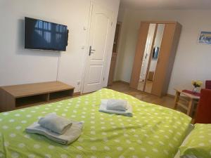 a bedroom with a bed with two towels on it at Gödeke Michels 2 in Zingst