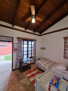 Cama ou camas em um quarto em Pousada Ikabana
