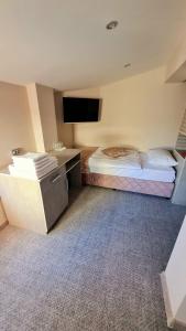 Postel nebo postele na pokoji v ubytování Hotel Ponti