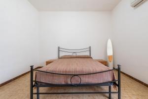 Posteľ alebo postele v izbe v ubytovaní Casa Vacanze Teulada