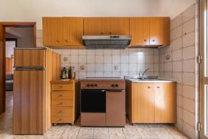 Kuchyňa alebo kuchynka v ubytovaní Casa Vacanze Teulada