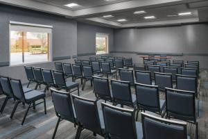 an empty room with chairs and a chalkboard at Hyatt House Fort Lauderdale Airport/Cruise Port in Dania Beach +30 photos