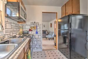 a kitchen with a stainless steel refrigerator at Pet-Friendly Malta Home Near Hunting Areas! in Malta