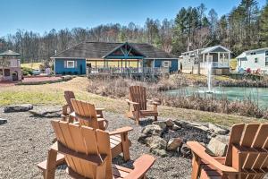 a group of chairs sitting in a yard with a house at Splendid Tiny Home with Fire Pit about 2 Mi to Lake! in Morganton