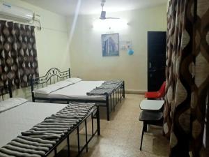 Postel nebo postele na pokoji v ubytování Stay Goa Guesthouse