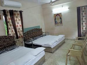 Postel nebo postele na pokoji v ubytování Stay Goa Guesthouse
