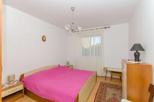 Ένα ή περισσότερα κρεβάτια σε δωμάτιο στο Apartments KATA