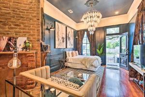 a living room with a couch and a chair at Walk to Magazine Street Contemporary NOLA Studio in New Orleans