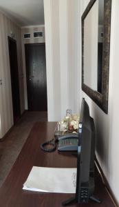 TV a/nebo společenská místnost v ubytování Guest House Palazzo