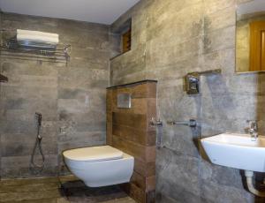 a bathroom with a toilet and a sink at Ekana Homes in Trivandrum