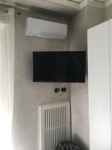 TV a/nebo společenská místnost v ubytování Manhattan House