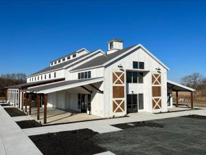 a large white barn with a gambrel at Kent Island Resort in Stevensville