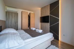 Posteľ alebo postele v izbe v ubytovaní MyFlat Coral Beach Apartment